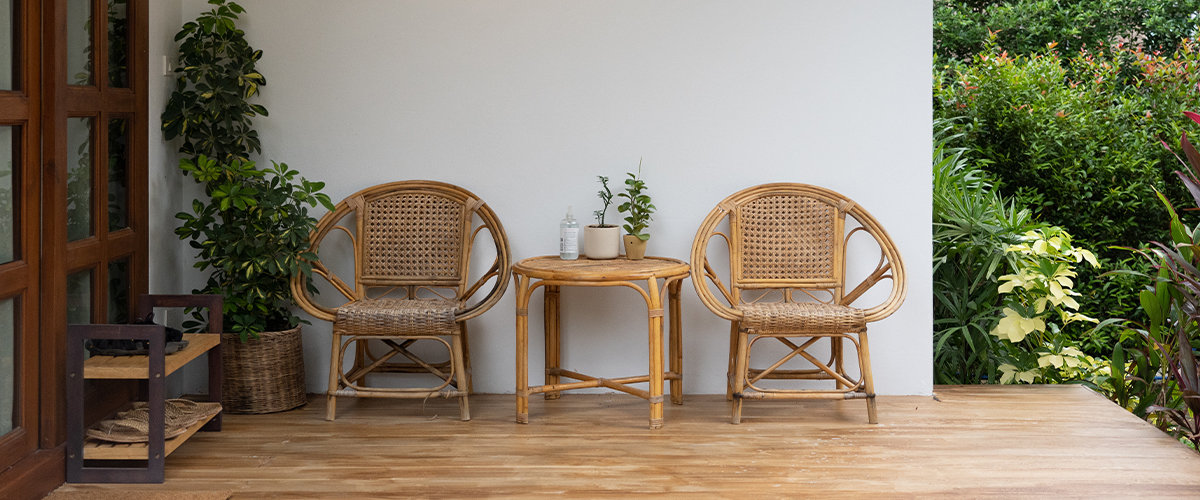 Wicker boho style chairs on terrace